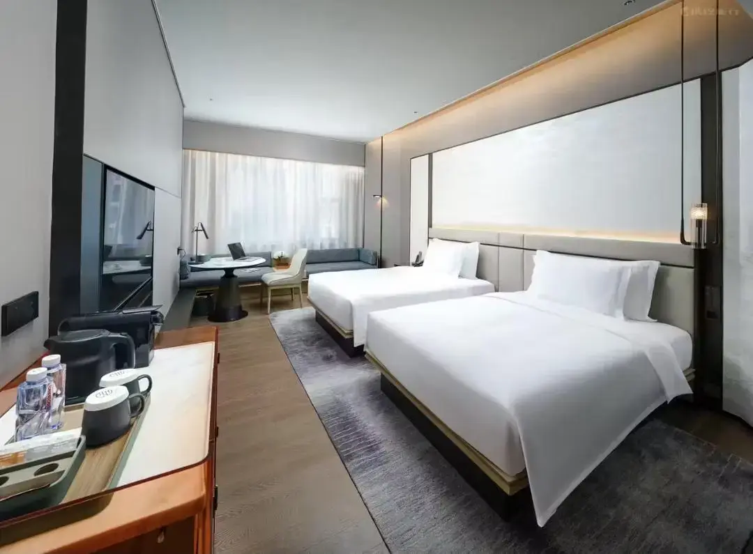 Luxurious hotel room interior with neatly made bed and modern decor
